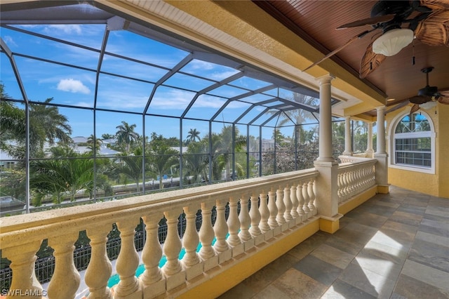 sunroom / solarium featuring ceiling fan