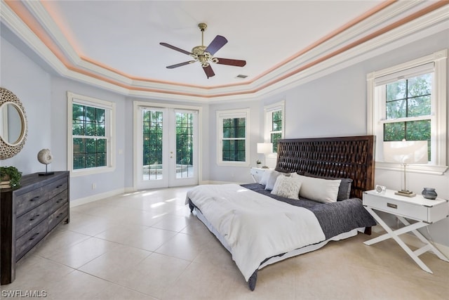 bedroom featuring french doors, access to exterior, ornamental molding, a raised ceiling, and ceiling fan