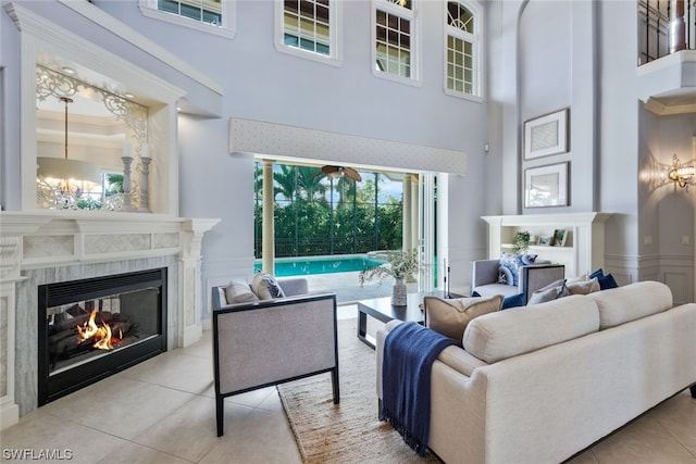 tiled living room featuring a towering ceiling