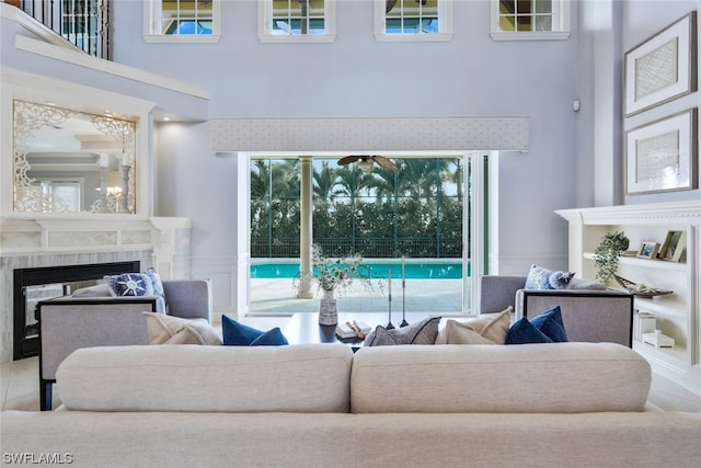 living room featuring a towering ceiling