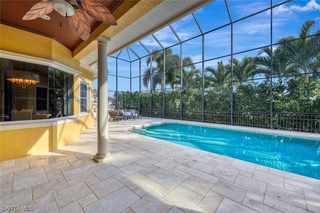 view of pool with a patio area, ceiling fan, and a lanai