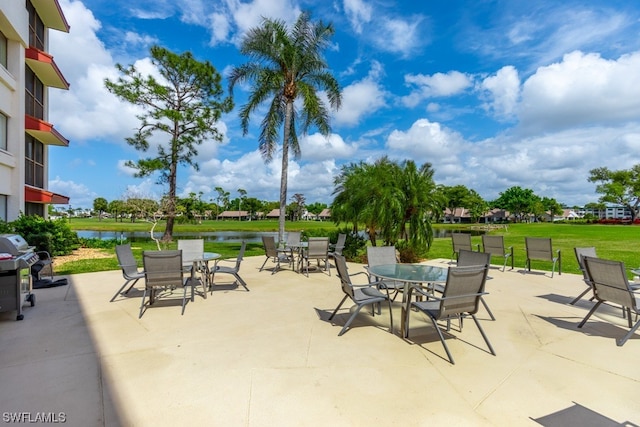 view of patio / terrace featuring a grill and a water view