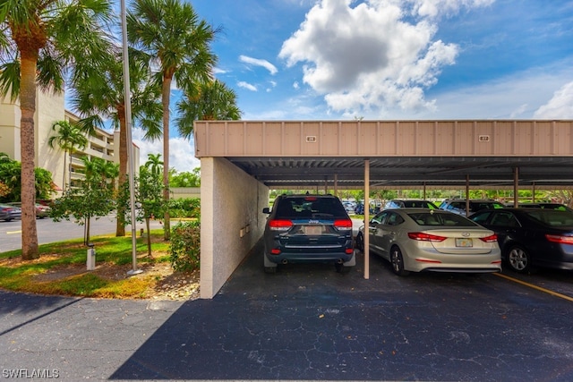 view of parking / parking lot featuring a carport