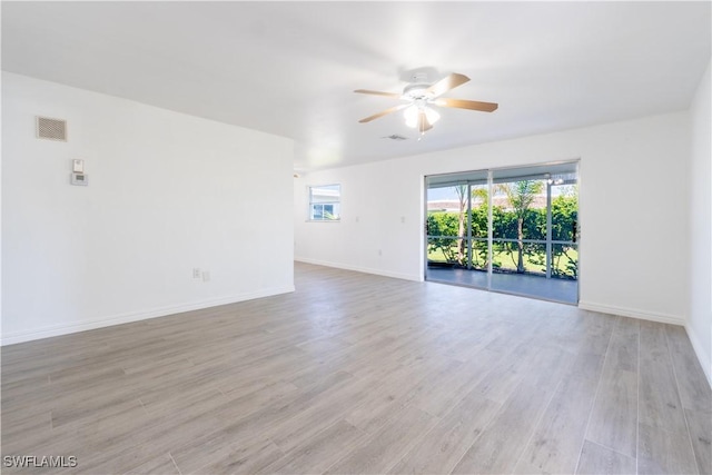 unfurnished room with ceiling fan and light wood-type flooring