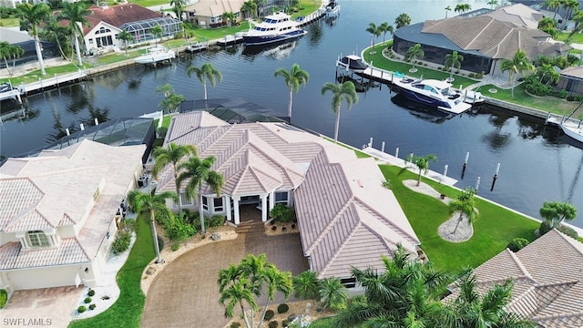 birds eye view of property with a water view