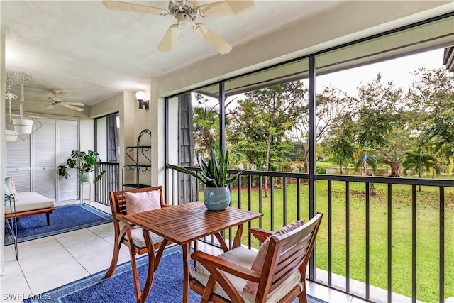 sunroom with a wealth of natural light and ceiling fan