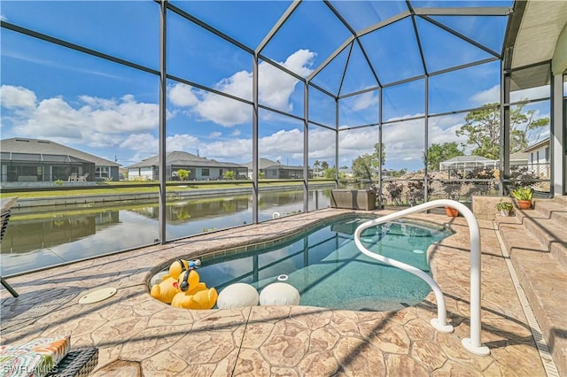 view of swimming pool with a water view, a patio area, and glass enclosure