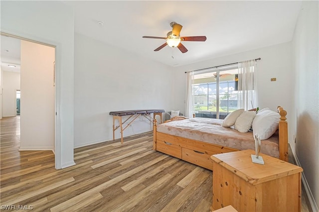 bedroom with ceiling fan and wood-type flooring