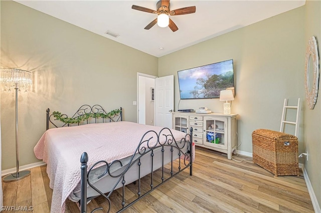 bedroom featuring ceiling fan and light hardwood / wood-style floors