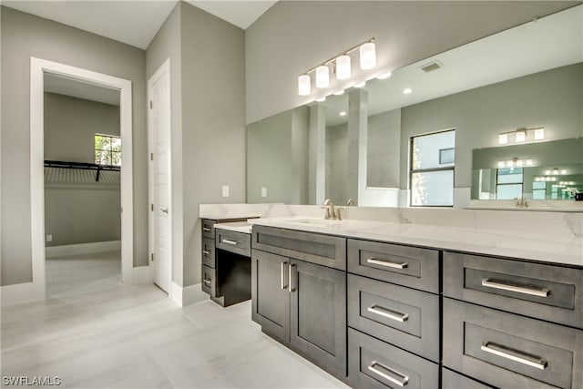 bathroom with vanity and tile flooring