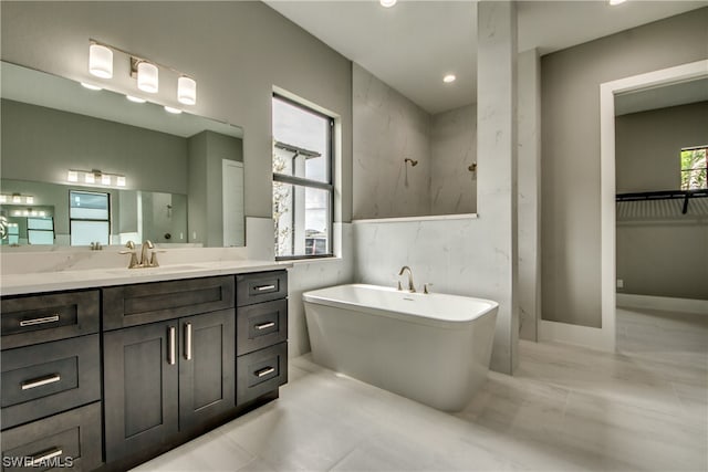 bathroom featuring tile walls, vanity, and tile flooring