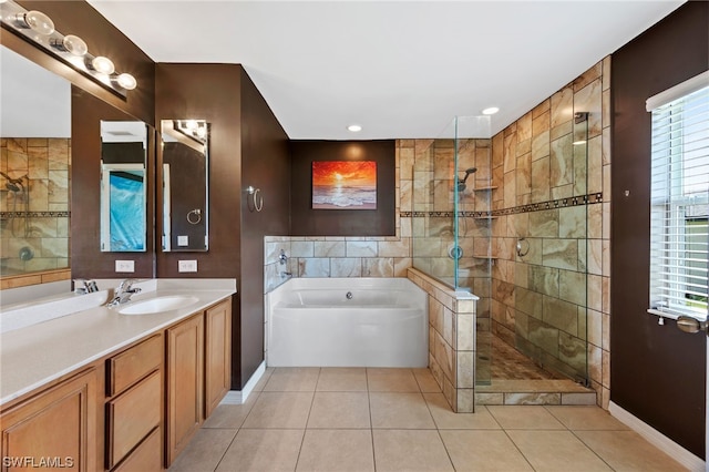 bathroom with tile patterned flooring, vanity, and shower with separate bathtub