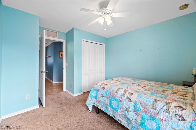 carpeted bedroom with a closet and ceiling fan