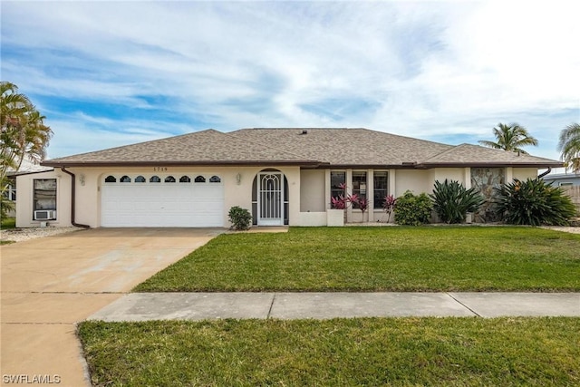 ranch-style home featuring a garage and a front lawn