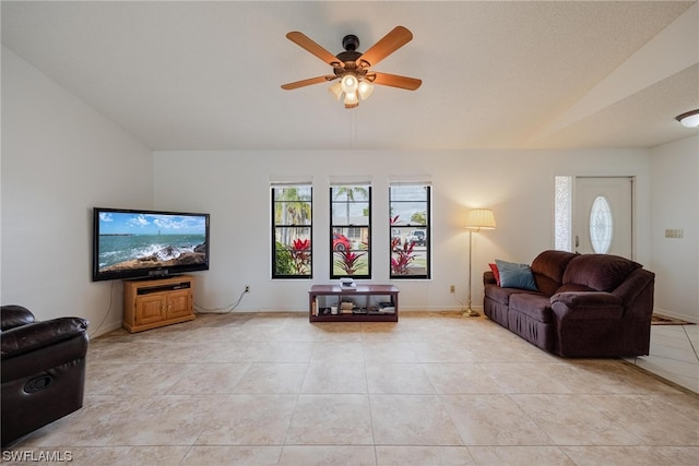 living room featuring ceiling fan and light tile patterned floors