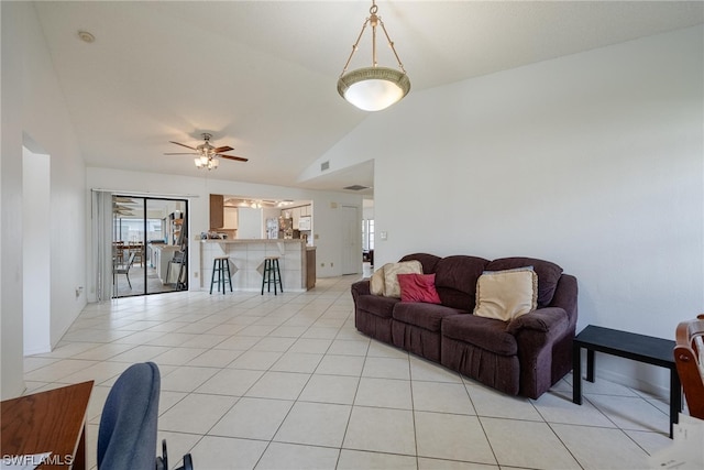 living room with light tile patterned floors, vaulted ceiling, and ceiling fan