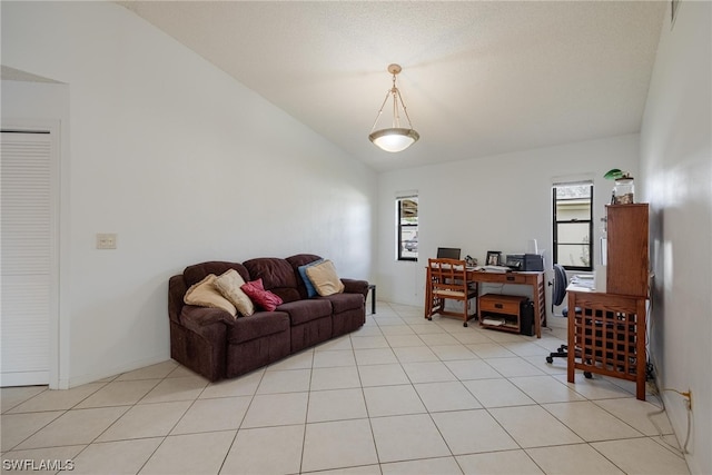 tiled living room with vaulted ceiling