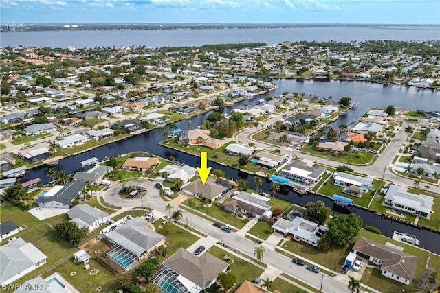 bird's eye view with a water view