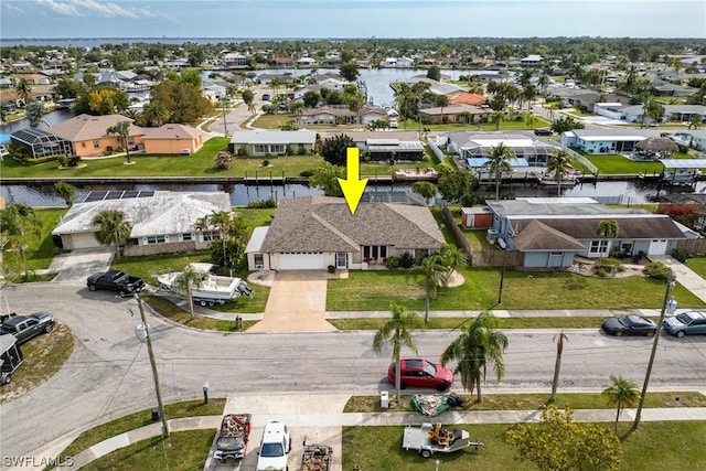 birds eye view of property featuring a water view