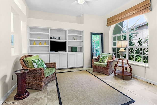 living area with a healthy amount of sunlight and light tile patterned floors