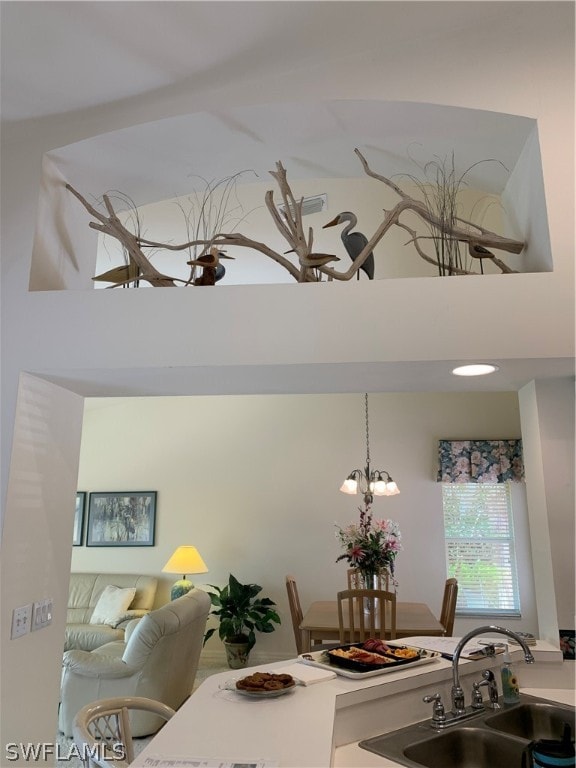 interior space featuring an inviting chandelier and sink