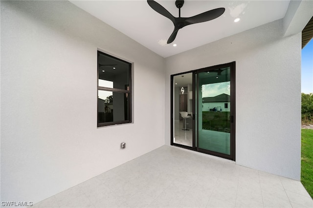 interior space with ceiling fan