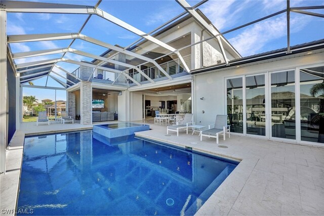 view of pool with a lanai and a patio