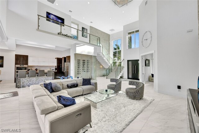 living room with a towering ceiling