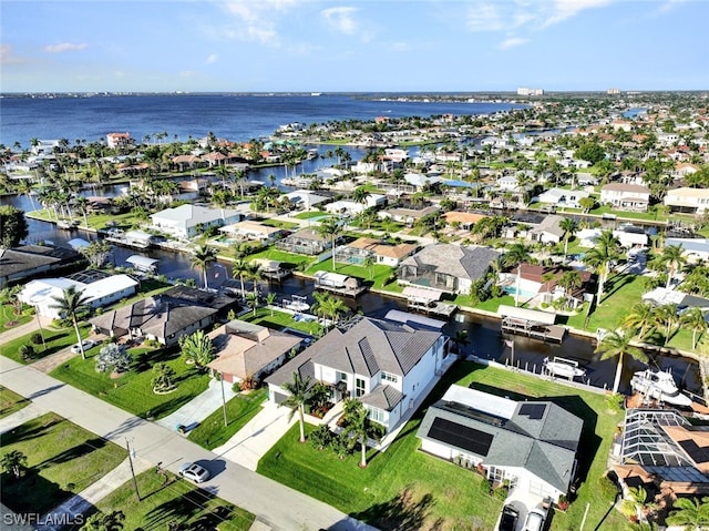 birds eye view of property featuring a water view