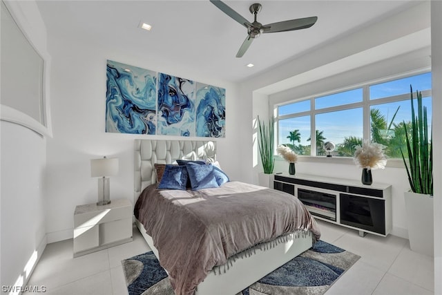 bedroom with light tile patterned floors and ceiling fan