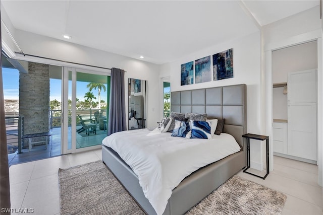 bedroom with light tile patterned flooring and access to outside