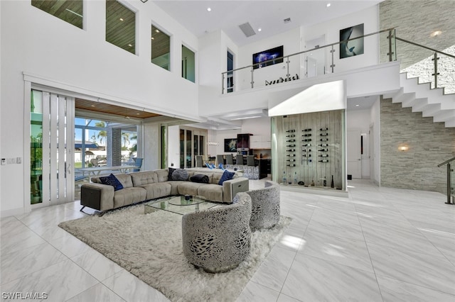 living room featuring a high ceiling