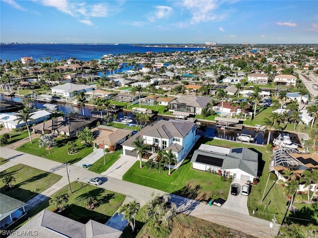 birds eye view of property featuring a water view