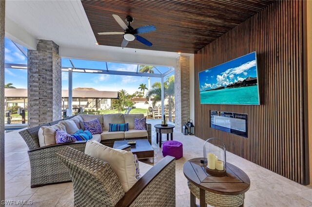 view of patio featuring an outdoor living space and ceiling fan