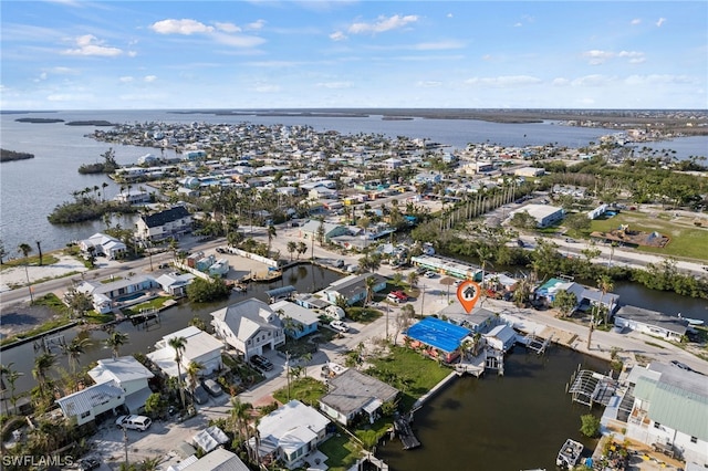 drone / aerial view with a water view