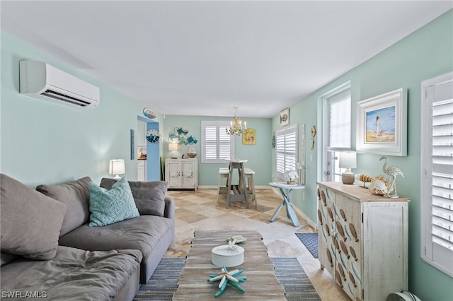 living room with a wall unit AC and a chandelier