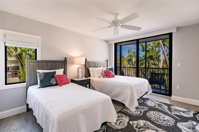 bedroom featuring ceiling fan, access to exterior, and dark hardwood / wood-style flooring