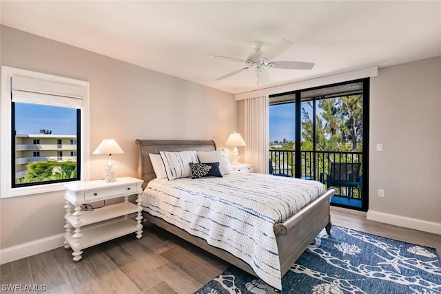 bedroom with access to exterior, dark hardwood / wood-style floors, and ceiling fan