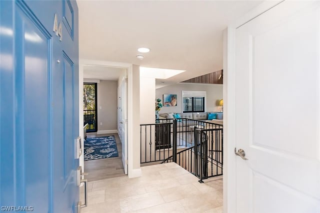 hallway with light tile flooring