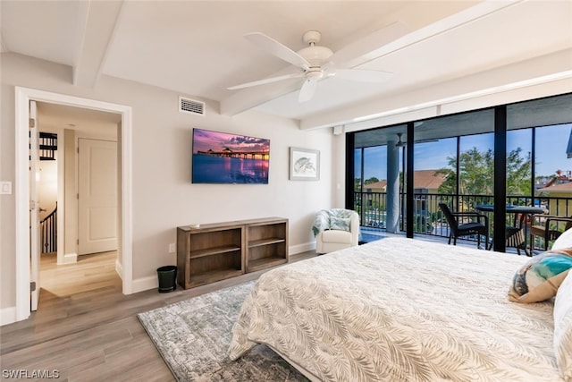 bedroom featuring light hardwood / wood-style flooring, ceiling fan, access to outside, and beamed ceiling