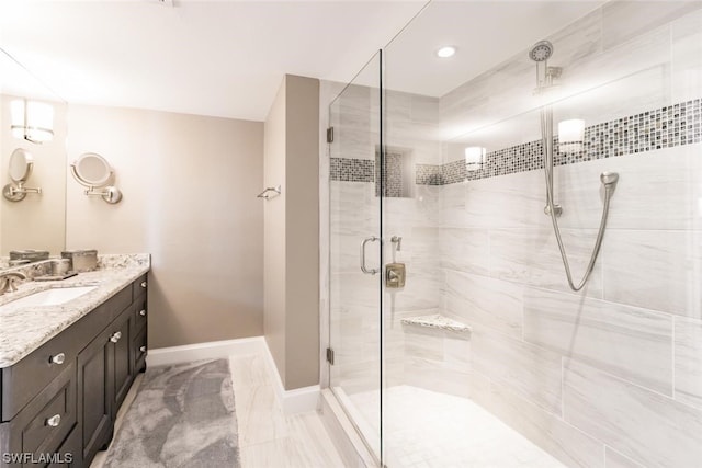 bathroom featuring vanity, tile floors, and a shower with door