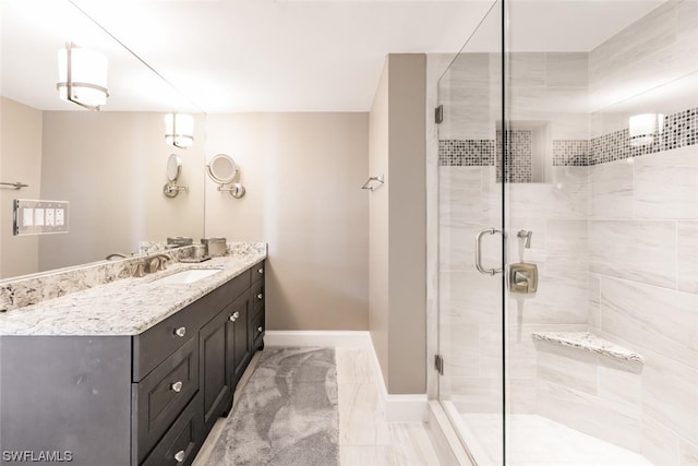 bathroom with walk in shower, vanity, and tile flooring