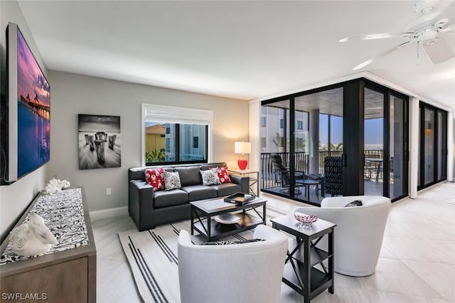 tiled living room featuring ceiling fan