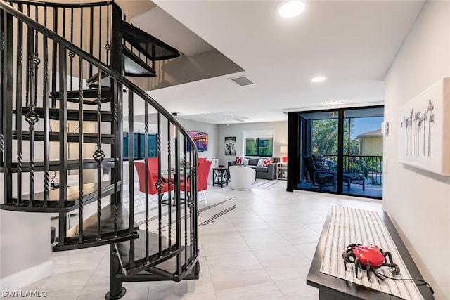 stairway with light tile floors