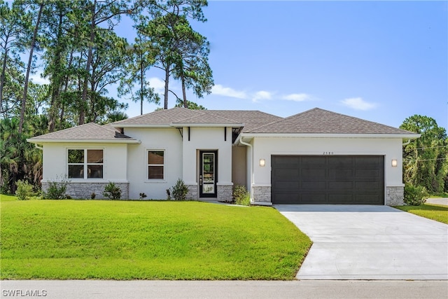 view of front of property featuring a front lawn and a garage