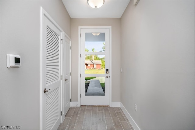 doorway with light hardwood / wood-style flooring