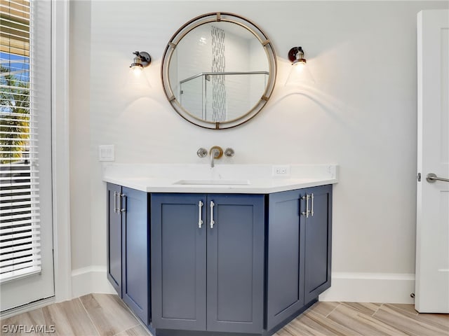 bathroom featuring wood-type flooring and vanity