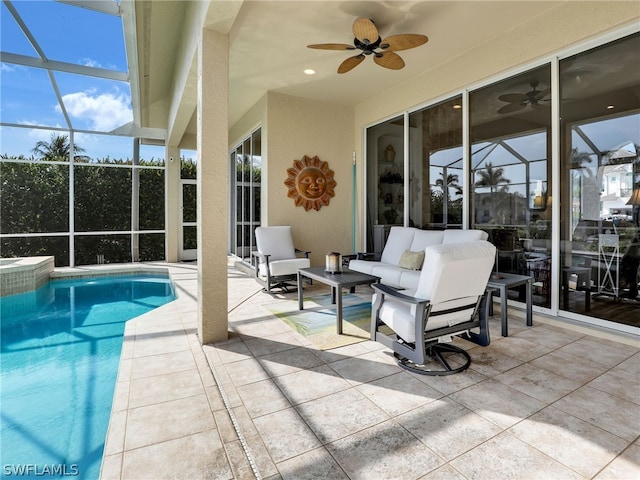 view of swimming pool featuring a lanai, a patio, ceiling fan, and outdoor lounge area