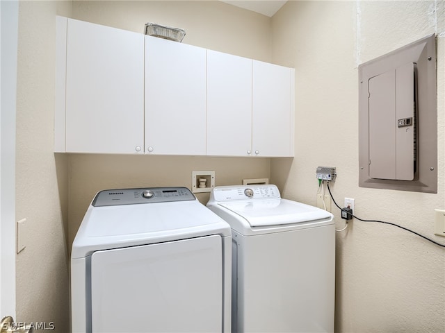 laundry room with hookup for a washing machine, cabinets, and separate washer and dryer