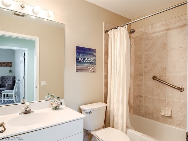 full bathroom with vanity, shower / bath combo with shower curtain, and toilet